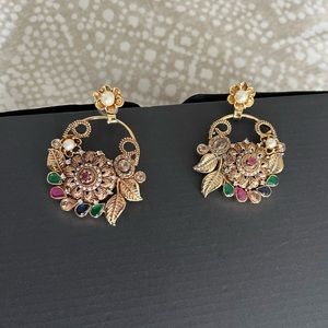 Dull gold earrings with royal colored stones